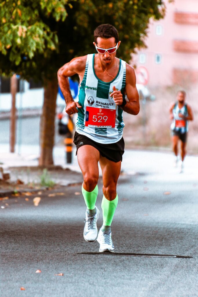 pexels-photo-3039888-3039888 Male athlete competing in a street marathon, showcasing endurance and determination.